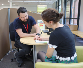 Support staff speaking to student and offering advice